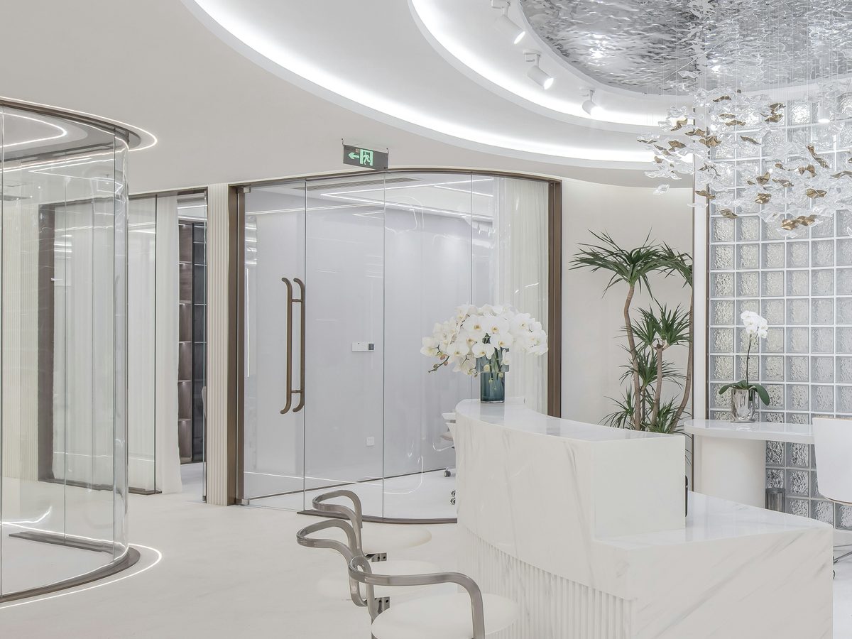 An empty reception desk and waiting area in a bright interior.